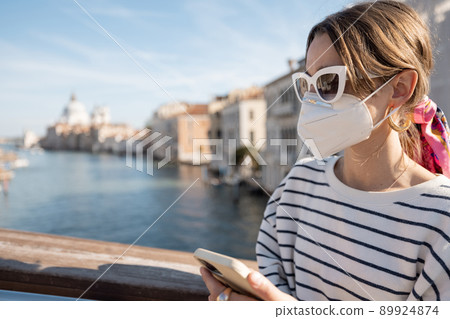 Woman traveling in Venice during pandemic Woman traveling in Venice during pandemic 89924874