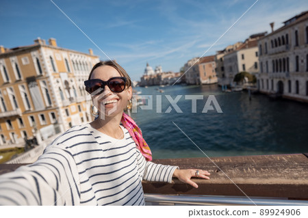 Woman traveling in Venice, Italy Woman traveling in Venice, Italy 89924906