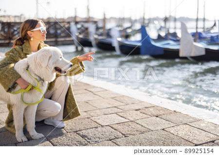 Woman walking central square while traveling in Venice 89925154
