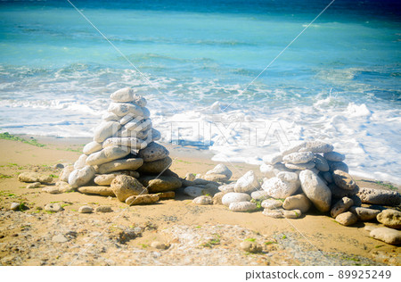 Pile of stones on the beach Pile of stones on the beach 89925249