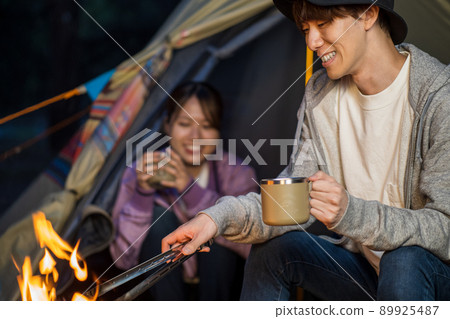 He who bonfires and she who sees it from inside the tent 89925487