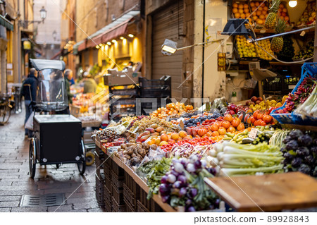 Street with market stalls full of fresh local food in Italy Street with market stalls full of fresh local food in Italy 89928843