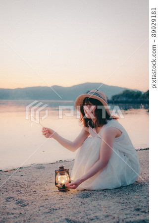 Beautiful summer sunset of a woman in a dress 89929181