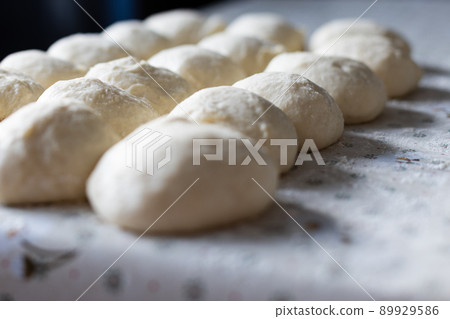 Balls from the dough for pies. Baking at home. Selective focus. Balls from the dough for pies. Baking at home. Selective focus. 89929586