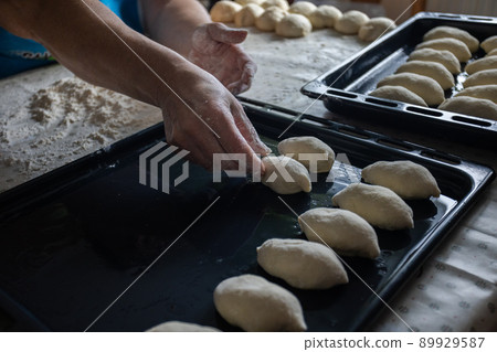Woman cooking pies at home. Cooking and baking at home. 89929587