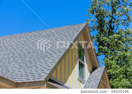 Aerial view the asphalt shingles roofing construction waterproofing for new house in covered corner roof shingles 89930106