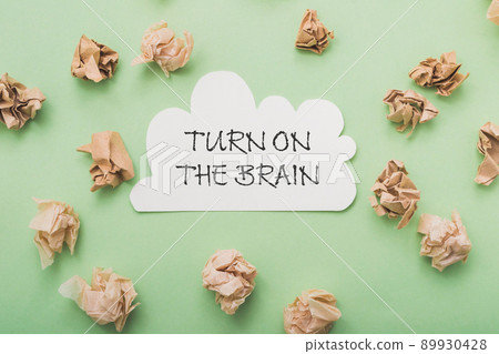 Composition with phrase Turn On Brain on green background 89930428