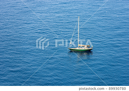 Green Sailing Boat Moored in the Blue Sea - Cinque Terre Liguria Italy 89930780