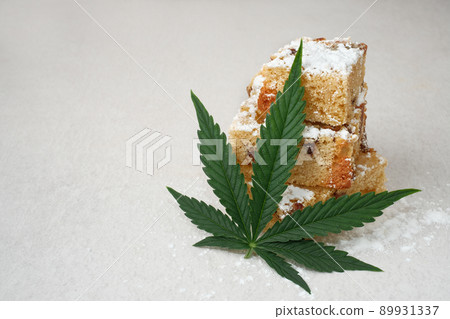 Homemade pie and powdered sugar with CBD oil. Cannabis kitchen Homemade pie and powdered sugar with CBD oil. Cannabis kitchen 89931337
