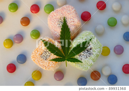 Turkish delight and colorful candy confetti with green cannabis leaf. 89931368