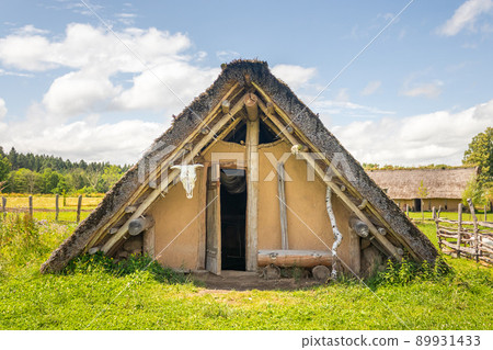 Celtic house with straw thatched roof at Celtic open air museum in Nasavrky, Czech republic Celtic house with straw thatched roof at Celtic open air museum in Nasavrky, Czech republic 89931433
