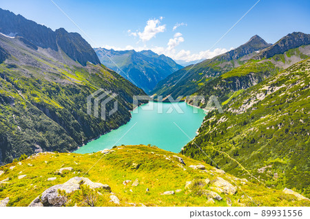 Beautiful alpine walley with azure blue water dam Beautiful alpine walley with azure blue water dam 89931556