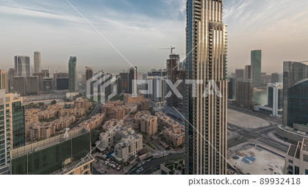 Panorama showing aerial panoramic skyline of a big futuristic city timelapse. Business bay and Downtown 89932418