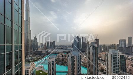Dubai downtown during sunrise with fountains and modern futuristic architecture aerial timelapse Dubai downtown during sunrise with fountains and modern futuristic architecture aerial timelapse 89932423