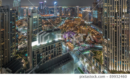 Aerial panoramic view of a big futuristic city night timelapse. Business bay and Downtown Aerial panoramic view of a big futuristic city night timelapse. Business bay and Downtown 89932460