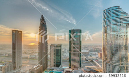 Sky view to skyscrapers during sunset in Dubai downtown aerial timelapse. 89932518