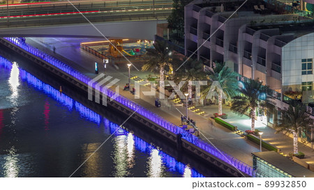 Dubai Marina waterfront and city promenade aerial night timelapse. 89932850