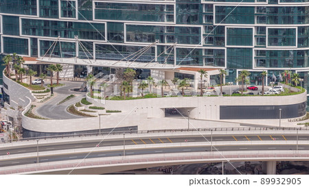 Promenade and palms seen from Dubai marina timelapse. Aerial view to JBR district 89932905