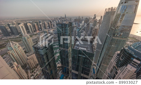 Dubai Marina and JLT district with traffic on highway between skyscrapers aerial timelapse. Dubai Marina and JLT district with traffic on highway between skyscrapers aerial timelapse. 89933027