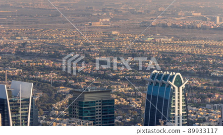 Houses and villas in Jumeirah Islands Community district with top of JLT skyscrapers timelapse Houses and villas in Jumeirah Islands Community district with top of JLT skyscrapers timelapse 89933117