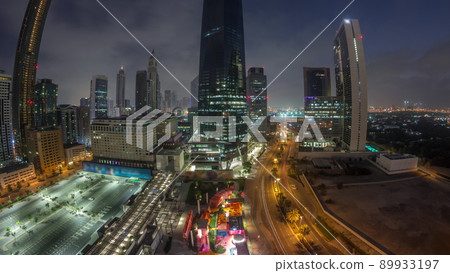 Panorama of Dubai International Financial district aerial night to day timelapse. View of business office towers. Panorama of Dubai International Financial district aerial night to day timelapse. View of business office towers. 89933197