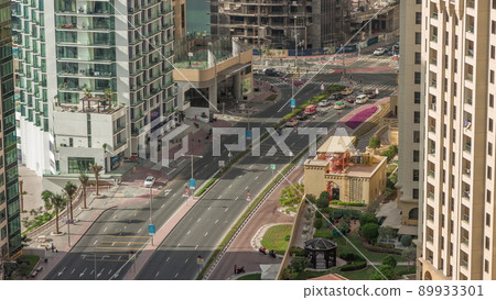 Aerial view of JBR street with heavy traffic timelapse. Dubai road and intersections. Aerial view of JBR street with heavy traffic timelapse. Dubai road and intersections. 89933301