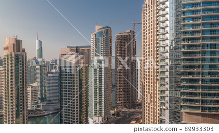 Aerial view on Dubai Marina skyscrapers and the most luxury yacht in harbor timelapse, Dubai, United Arab Emirates Aerial view on Dubai Marina skyscrapers and the most luxury yacht in harbor timelapse, Dubai, United Arab Emirates 89933303