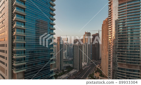 Panoramic view of the Dubai Marina and JBR area and the famous Ferris Wheel aerial morning timelapse Panoramic view of the Dubai Marina and JBR area and the famous Ferris Wheel aerial morning timelapse 89933304