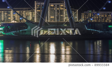 Bluewaters island with modern architecture and ferris wheel aerial night timelapse. 89933384