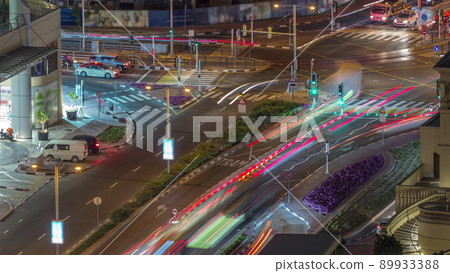 Aerial view of JBR street with heavy traffic night timelapse. Dubai road and intersections. Aerial view of JBR street with heavy traffic night timelapse. Dubai road and intersections. 89933388