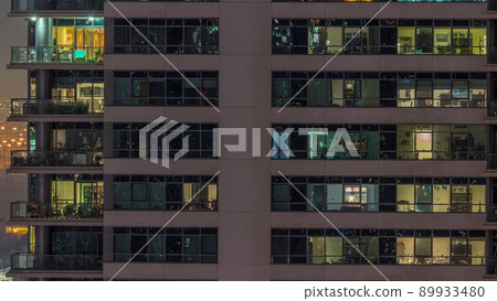 Windows lights in modern office and residential buildings timelapse at night Windows lights in modern office and residential buildings timelapse at night 89933480