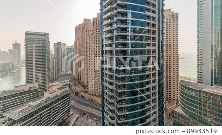 Panorama showing overview to JBR and Dubai Marina skyline with modern high rise skyscrapers waterfront living apartments aerial timelapse Panorama showing overview to JBR and Dubai Marina skyline with modern high rise skyscrapers waterfront living apartments aerial timelapse 89933519