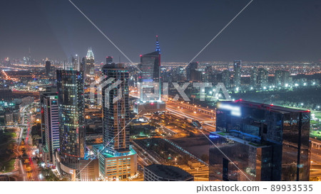 Aerial view of media city and al barsha heights district area all night timelapse from Dubai marina. Aerial view of media city and al barsha heights district area all night timelapse from Dubai marina. 89933535