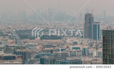 Dubai Downtown skyline row of skyscrapers with tallset tower aerial day to night timelapse. UAE Dubai Downtown skyline row of skyscrapers with tallset tower aerial day to night timelapse. UAE 89933683