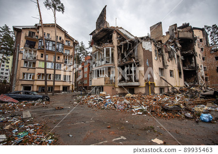 Irpin, Kyev region Ukraine - 09.04.2022: Cities of Ukraine after the Russian occupation. Destroyed buildings on the streets of Irpen. Broken, shelled windows. Buildings after being hit by missiles. 89935463
