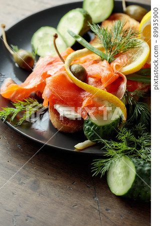 Sandwich with salmon and greens. Sandwich with salmon and greens. 89935900