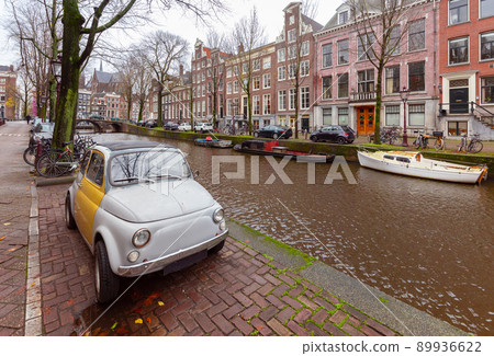 Beautiful old houses on the city waterfront of Amsterdam at sunset. Beautiful old houses on the city waterfront of Amsterdam at sunset. 89936622