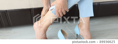 Woman took off her shoes, legs close up Woman took off her shoes, legs close up 89936625