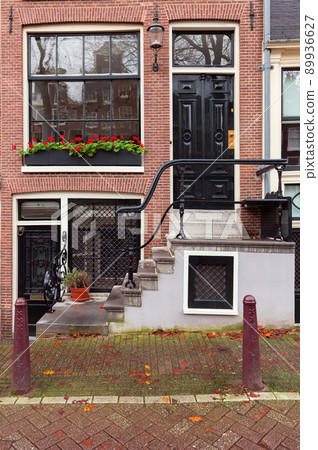 Beautiful old houses on the embankment of the city of Amsterdam in autumn. Beautiful old houses on the embankment of the city of Amsterdam in autumn. 89936627