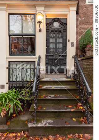 Beautiful old houses on the embankment of the city of Amsterdam in autumn. Beautiful old houses on the embankment of the city of Amsterdam in autumn. 89936630