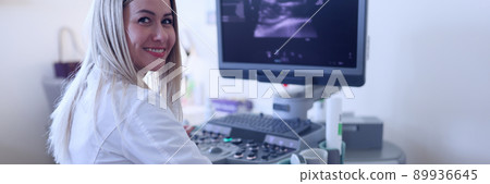 The ultrasound doctor examines the woman's abdominal cavity The ultrasound doctor examines the woman's abdominal cavity 89936645