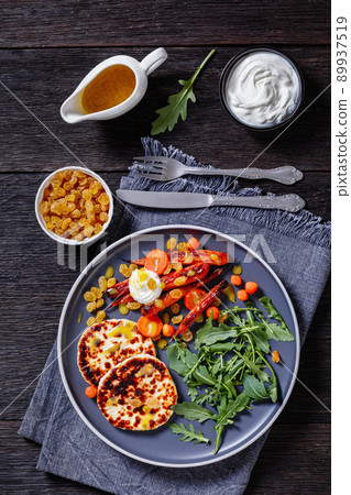 baby carrot salad and grilled halloumi cheese baby carrot salad and grilled halloumi cheese 89937519