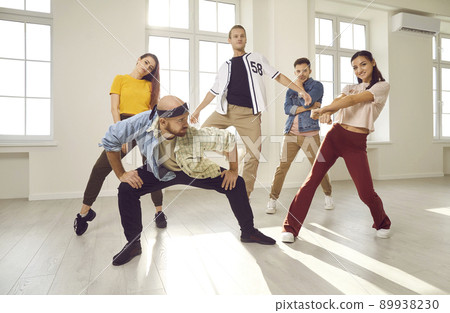 Group of young contemporary or hip hop dancers dancing together in a modern studio 89938230
