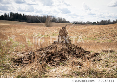Plowed field. Tillage in the spring before sowing 89938343
