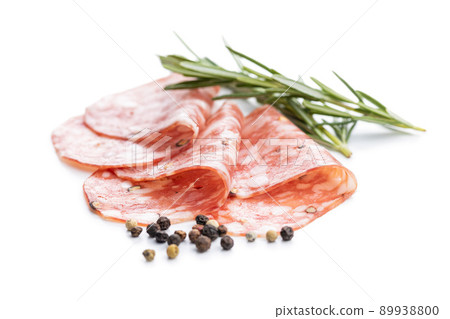 Sliced italian salami sausage with peppercorn isolated on white background. Sliced italian salami sausage with peppercorn isolated on white background. 89938800