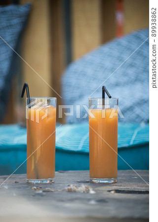 Closeup of two glasses of cocktail at the bar terrace in outdoor Closeup of two glasses of cocktail at the bar terrace in outdoor 89938862
