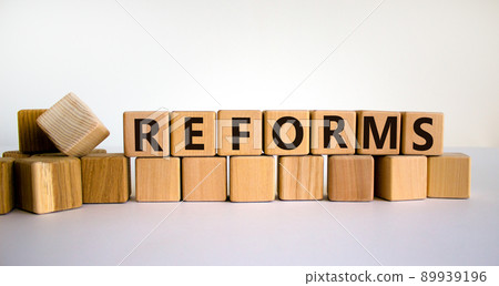 Concept word 'reforms' on wooden cubes on a beautiful white background. Business concept. Copy space. Concept word 'reforms' on wooden cubes on a beautiful white background. Business concept. Copy space. 89939196