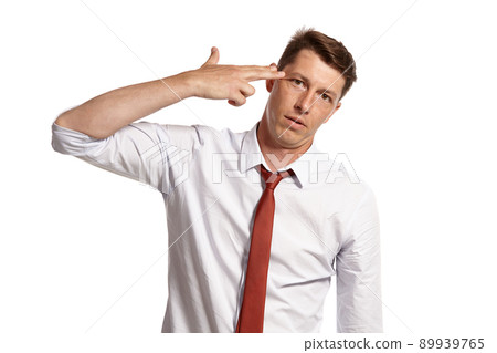 Young man in a classic white shirt and red tie posing isolated on white background. Young man in a classic white shirt and red tie posing isolated on white background. 89939765