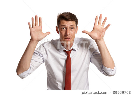 Portrait of a young brunet man posing in a studio isolated over a white background. Portrait of a young brunet man posing in a studio isolated over a white background. 89939768