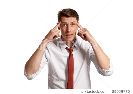Portrait of a young brunet man posing in a studio isolated over a white background. Portrait of a young brunet man posing in a studio isolated over a white background. 89939770